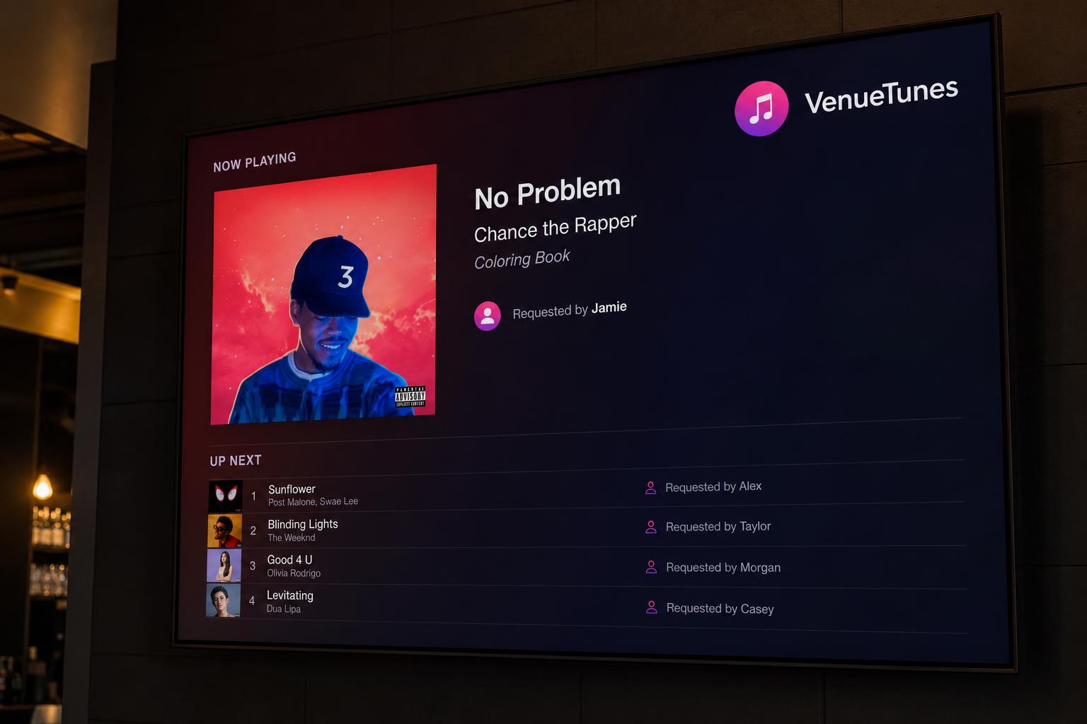 Close-up of the VenueTunes display screen showing the now-playing track.